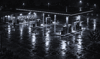 Night camera view of a gas station forecourt and store