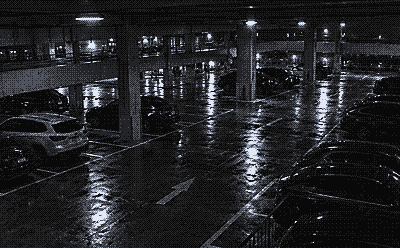 Night camera view inside a multi level parking garage