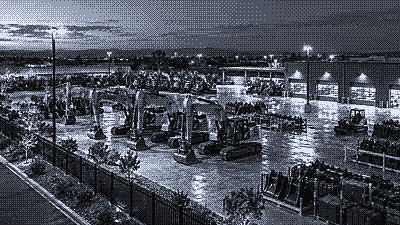 Night camera view of an industrial yard with stored equipment
